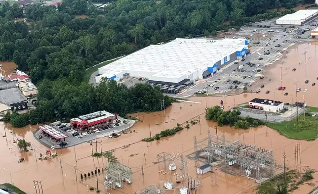 An Aerial view shows extensive flooding in Buckhannon, W.Va., Wednesday, July 22, 2026. (Office of West Virginia Gov. Patrick Morrisey via AP)
