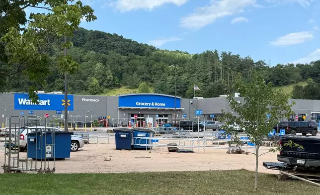 The parking lot of the Walmart in Weston, W.Va., after severe floods on Wednesday, July 22, 2026. (AP Photo/Patrick Aftoora-Orsagos)