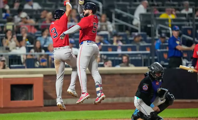 Boston Red Sox's Wilyer Abreu (52) celebrates with Ceddanne Rafaela (3) after they scored on a two-run home run by Abreu as New York Mets catcher Francisco Alvarez reacts of a baseball game Friday, July 10, 2026, in New York. (AP Photo/Frank Franklin II)