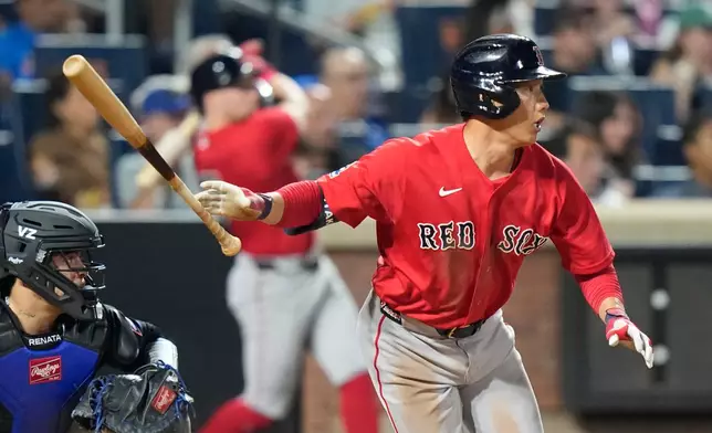 Boston Red Sox's Masataka Yoshida follows through on a double during the seventh inning of a baseball game against the New York Mets Friday, July 10, 2026, in New York. (AP Photo/Frank Franklin II)