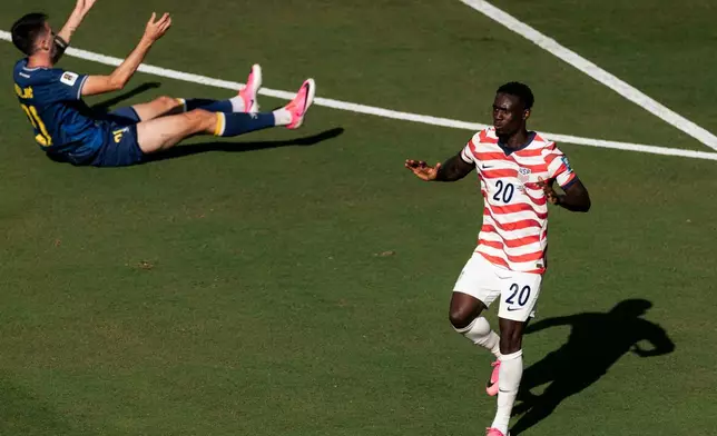 United States forward Folarin Balogun (20) gestures after scoring a goal during the first half of the World Cup 2026 Round of 32 Football match between United States and Bosnia and Herzegovina in Santa Clara, Calif., Wednesday, July 1, 2026. (Stephen Lam/San Francisco Chronicle via AP)