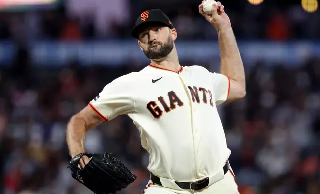 San Francisco Giants pitcher Sam Hentges throws against the Milwaukee Brewers during the seventh inning of a baseball game in San Francisco, Monday, July 27, 2026. (AP Photo/Jed Jacobsohn)