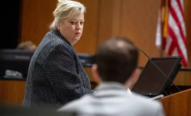 Defense attorney Kathryn Nester looks back past Tyler Robinson, who is accused of fatally shooting Charlie Kirk, during a preliminary hearing in 4th District Court, in Provo, Utah, Tuesday, July 7, 2026. (Trent Nelson/The Salt Lake Tribune via AP, Pool)