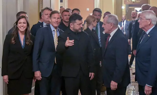 Ukraine's President Volodymyr Zelenskyy, center, is joined by from left: Sen. Katie Britt, R-Ala., Sen. Richard Blumenthal, D-Conn., Sen. James Risch, R-Idaho, and Sen. Roger Wicker, R-Miss., as he arrives at the U.S. Capitol for a meeting of bipartisan leaders of the Lindsey O. Graham Sanctioning Russia and Iran Act of 2026, Tuesday, July 28, 2026, in Washington. (AP Photo/Rod Lamkey, Jr.)