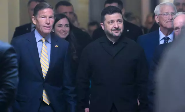 Ukraine President Volodymyr Zelenskyy, is joined by from left: Sen. Richard Blumenthal, D-Conn., Sen. Katie Boyd Britt, R-Ala., Sen. Roger Wicker, R-Miss., and Sen. James Risch, R-Idaho, as he arrives at the U.S. Capitol for a meeting of bipartisan leaders of the Lindsey O. Graham Sanctioning Russia and Iran Act of 2026, Tuesday, July 28, 2026, in Washington. (AP Photo/Rod Lamkey, Jr.)
