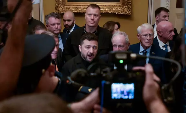 Ukraine's President Volodymyr Zelenskyy, center, speaks to reporters at the U.S. Capitol with from left: Sen. Richard Blumenthal, D-Conn., Sen. James Risch, R-Idaho, Sen. Roger Wicker, R-Miss., and Sen. Mark Kelly, D-Ariz., following a meeting of bipartisan leaders of the Lindsey O. Graham Sanctioning Russia and Iran Act of 2026, Tuesday, July 28, 2026, in Washington. (AP Photo/Rod Lamkey, Jr.)