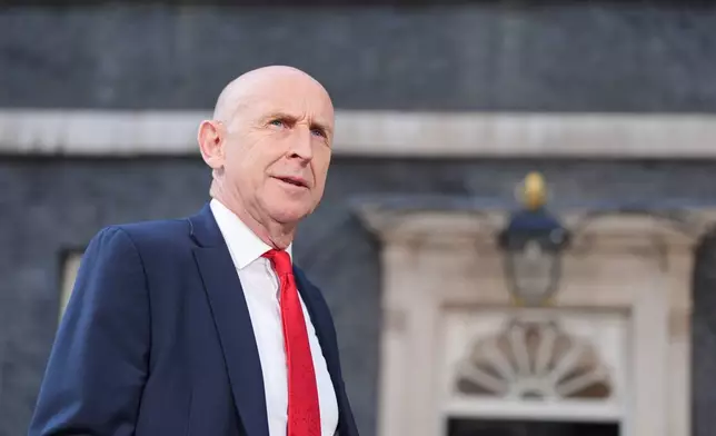 Newly appointed Chancellor of the Exchequer John Healey leaves number 10 Downing Street, as new British Prime Minister Andy Burnham has entered number 10 Downing Street and among his first tasks is the selection of his new Cabinet, in London, Monday July 20, 2026. (Yui Mok/PA via AP)