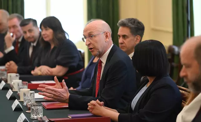 Britain's Chancellor of the Exchequer John Healey, center, attends the first cabinet meeting held by Prime Minister Andy Burnham at 10 Downing Street, London, Tuesday July 21, 2026. (Eddie Mulholland/Pool Photo via AP)