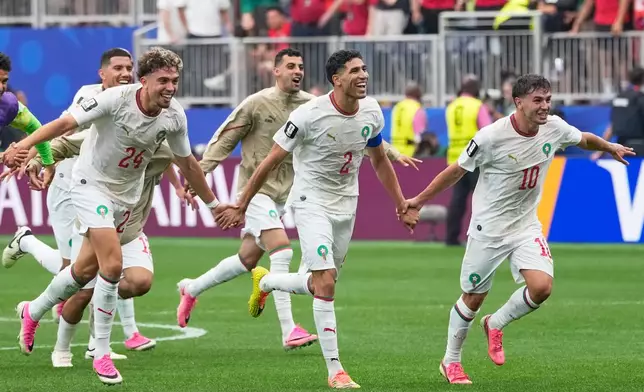Players of Morocco react after the World Cup round of 16 soccer match against Canada in Houston, Saturday, July 4, 2026. (AP Photo/David J. Phillip)