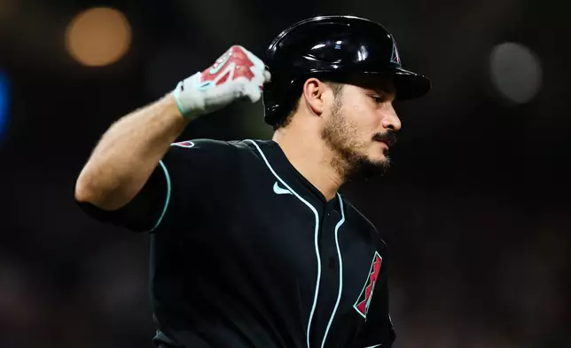 Arizona Diamondbacks' Nolan Arenado celebrates as he runs the bases after hitting a solo home run against the San Diego Padres in the sixth inning of a baseball game Thursday, July 9, 2026, in San Diego. (AP Photo/Derrick Tuskan)