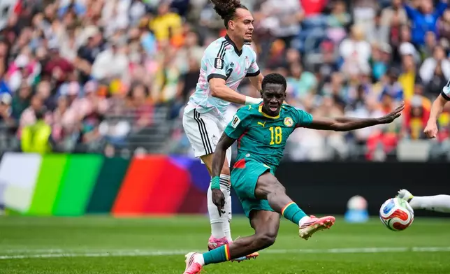 Senegal's Ismaila Sarr (18) scores their second goal during the World Cup round of 32 soccer match between Belgium and Senegal in Seattle, Wednesday, July 1, 2026. (AP Photo/Lindsey Wasson)