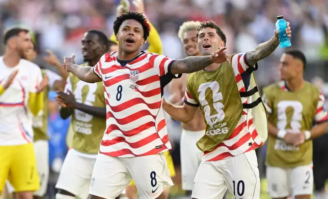 United States' Weston McKennie (8) and Christian Pulisic (10) celebrate winning the World Cup round of 32 soccer match between the United States and Bosnia in Santa Clara, Calif., near San Francisco, Wednesday, July 1, 2026. (AP Photo/Eakin Howard)