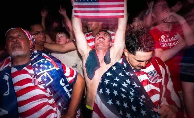 People attend a watch party for a World Cup soccer match between the United States and Bosnia Wednesday, July 1, 2026, in Washington, at the FIFA Fan Zone on the National Mall. (AP Photo/Allison Robbert)