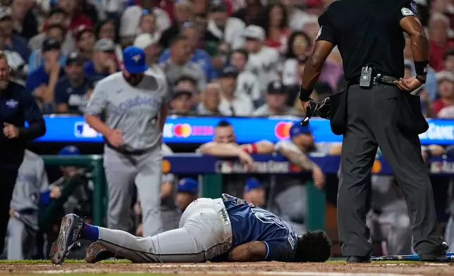 Tampa Bay Rays' Junior Caminero reacts after being hit by a pitch by St. Louis Cardinals' Riley O'Brien in the third inning of the MLB baseball All-Star Game between the American League and National League, Tuesday, July 14, 2026, in Philadelphia. (AP Photo/Matt Slocum)