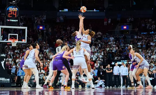 Toronto Tempo's Nyara Sabally (8) and Phoenix Mercury's Kyara Linskens (31) jump for the ball at the start of first half of an WNBA basketball game in Toronto, on Saturday, June 27, 2026. (Sammy Kogan /The Canadian Press via AP)