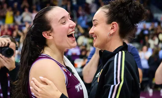 Toronto Tempo's Marina Mabrey, left, celebrates with her sister Michaela Mabrey after her team's win over the Los Angeles Sparks in a WNBA basketball game in Toronto, Thursday, June 25, 2026. (Sammy Kogan/The Canadian Press via AP)