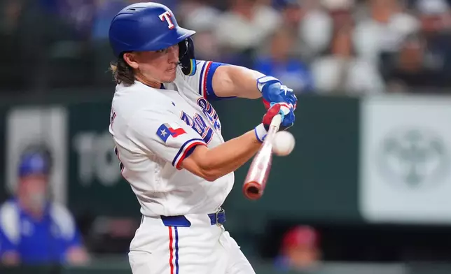 Texas Rangers' Cam Cauley hits a home run during the second inning of a baseball game against the Chicago White Sox, Wednesday, July 22, 2026, in Arlington, Texas. (AP Photo/LM Otero)