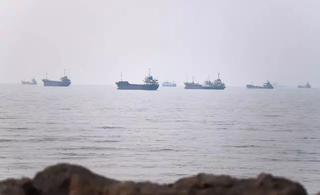 Commercial vessels are seen in the Strait of Hormuz off Bandar Abbas, Iran, Tuesday, June 30, 2026. (Amirhosein Khorgooi/ISNA via AP)