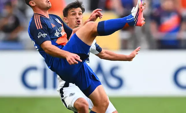 FC Cincinnati midfielder Pavel Bucha, front, collects a loose ball as Vancouver Whitecaps FC midfielder Andrés Cubas, back, defends during the first half of an MLS soccer game in Cincinnati, Wednesday, July 22, 2026. (AP Photo/Ben Jackson)