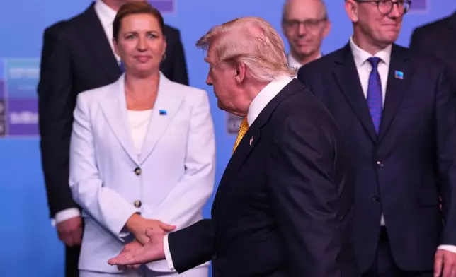 From left, Denmark's Prime Minister Mette Frederiksen, President Donald Trump and Estonia's Prime Minister Kristen Michal, during a group photo of NATO heads of state and government at the NATO summit in Ankara, Turkey, Wednesday, July 8, 2026. (AP Photo/Francisco Seco)