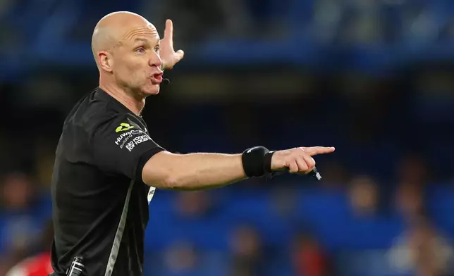 FILE - Referee Anthony Taylor makes a call during the English Premier League soccer match between Chelsea and Arsenal in London, Nov. 30, 2025. (AP Photo/Ian Walton, File)