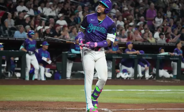 Arizona Diamondbacks' Ketel Marte reacts after missing a pitch against the Milwaukee Brewers in the seventh inning of a baseball game, Friday, July 3, 2026, in Phoenix. (AP Photo/Rick Scuteri)
