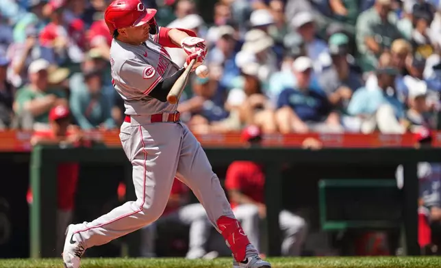 Cincinnati Reds' Sal Stewart hits a three-run home run against the Seattle Mariners during the seventh inning of a baseball game, Wednesday, July 22, 2026, in Seattle. (AP Photo/Lindsey Wasson)