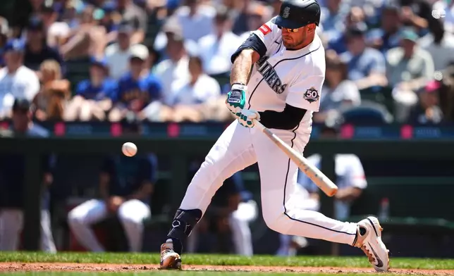 Seattle Mariners' Luke Raley hits a two-run single against the Cincinnati Reds during the fourth inning of a baseball game, Wednesday, July 22, 2026, in Seattle. (AP Photo/Lindsey Wasson)