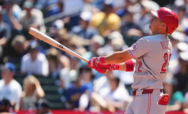 Cincinnati Reds' JJ Bleday follows through on a solo home run against the Seattle Mariners during the fourth inning of a baseball game, Wednesday, July 22, 2026, in Seattle. (AP Photo/Lindsey Wasson)