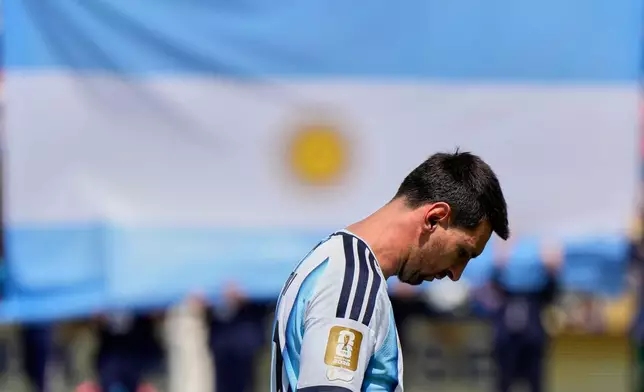 Argentina's Lionel Messi walks across the pitch before the World Cup final soccer match between Spain and Argentina in East Rutherford, N.J., near New York, Sunday, July 19, 2026. (AP Photo/Ashley Landis)