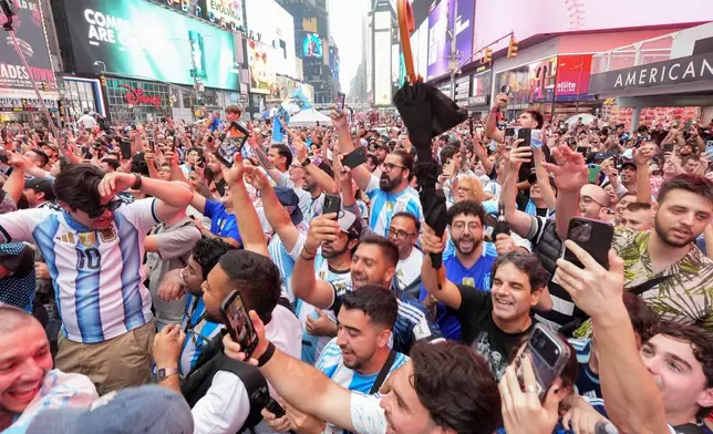 Argentina fans gather for a rally on the eve of the World Cup final soccer match in New York's Times Square, Saturday, July 18, 2026 (AP Photo/Frank Franklin II)