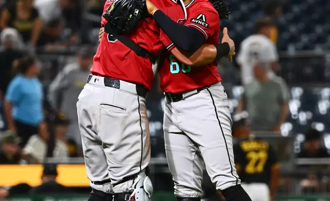 Arizona Diamondbacks pitcher Gerardo Carrillo (68) celebrates with catcher James McCann, left, after getting the final out of a baseball game against the Pittsburgh Pirates in Pittsburgh, Tuesday, July 28, 2026. (AP Photo/Justin Berl)