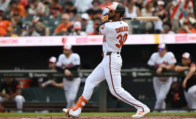Baltimore Orioles' Leody Taveras follows through on a two-run home run against the Kansas City Royals in the second inning of a baseball game Sunday, July 12, 2026, in Baltimore, Md. (AP Photo/Gail Burton)
