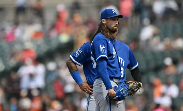 Kansas City Royals pitcher Matt Strahm, front, pauses after giving up four runs to the Baltimore Orioles in the sixth inning of a baseball game Sunday, July 12, 2026, in Baltimore, Md. (AP Photo/Gail Burton)