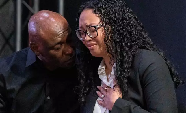 Christine and Elmore Wonsley, parents of Nolan Xavier Wells, react during a news conference at National Action Network headquarters, Friday, July 10, 2026, in New York. (AP Photo/Yuki Iwamura)