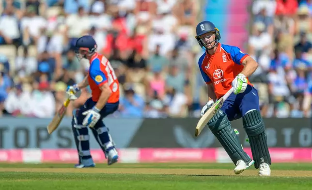 England's Harry Brook, left, and Jos Buttler during the international T20 Cricket match between England and India in Southampton, England, Saturday, July 11, 2026. (AP Photo/Anthony Upton)