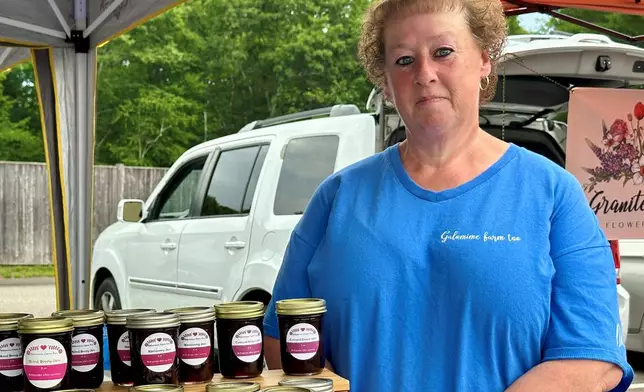 Mindy Dean poses for a photo at the farmers market in Bedford, N.H., Tuesday, June 30, 2026. (AP Photo/Holly Ramer)