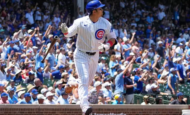 Chicago Cubs' Seiya Suzuki of Japan, watches his three-run home run during the first inning of a baseball game against the San Diego Padres in Chicago, Wednesday, July 1, 2026. (AP Photo/Nam Y. Huh)