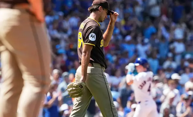San Diego Padres relief pitcher Kyle Hart reacts after Chicago Cubs' Pete Crow-Armstrong hit a three-run home run during the fifth inning of a baseball game in Chicago, Wednesday, July 1, 2026. (AP Photo/Nam Y. Huh)