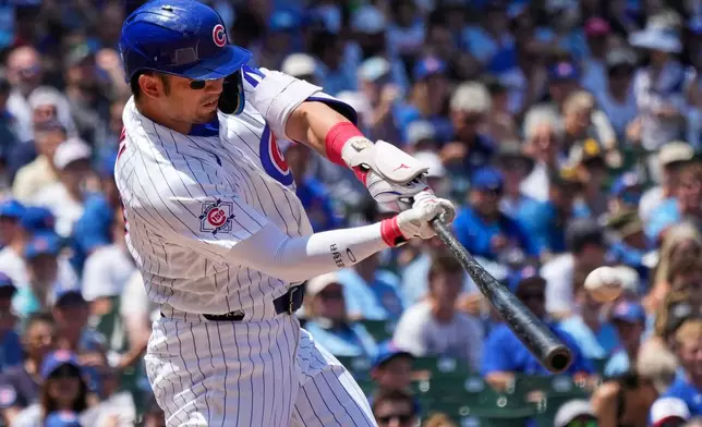 Chicago Cubs' Seiya Suzuki of Japan, hits a three-run home run during the first inning of a baseball game against the San Diego Padres in Chicago, Wednesday, July 1, 2026. (AP Photo/Nam Y. Huh)