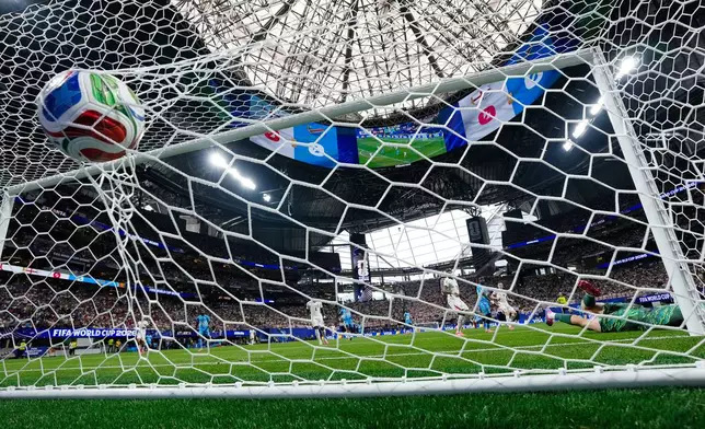 England goalkeeper Jordan Pickford (1) is scored on by Congo's Brian Cipenga as the ball hits the back of the net during the World Cup round of 32 soccer match between England and Congo in Atlanta, Wednesday, July 1, 2026. (AP Photo/Erik S. Lesser)