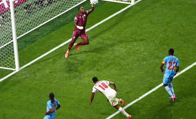 Congo goalkeeper Lionel Mpasi (1) saves during the World Cup round of 32 soccer match between England and Congo in Atlanta, Wednesday, July 1, 2026. (AP Photo/Colin Hubbard)