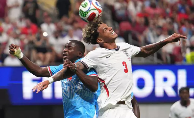 Congo's Noah Sadiki (14) and England's Nico O'Reilly (3) jump for the ball during the World Cup round of 32 soccer match between England and Congo in Atlanta, Wednesday, July 1, 2026. (AP Photo/Jacob Kupferman)