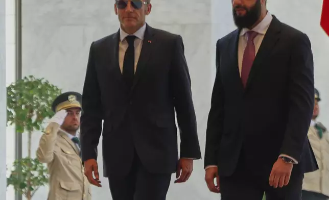 Syrian President Ahmad al-Sharaa, right, meets French President Emmanuel Macron at the presidential palace in Damascus, Syria, Tuesday, July 7, 2026. (AP Photo/Ghaith Alsayed)