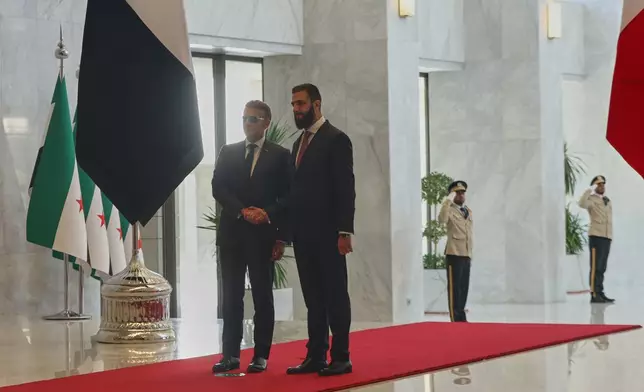 Syrian President Ahmad al-Sharaa meets French President Emmanuel Macron at the presidential palace in Damascus, Syria, Tuesday, July 7, 2026. (AP Photo/Ghaith Alsayed)