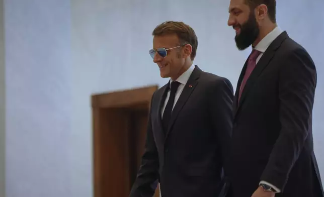 Syrian President Ahmad al-Sharaa, right, meets French President Emmanuel Macron at the presidential palace in Damascus, Syria, Tuesday, July 7, 2026. (AP Photo/Ghaith Alsayed)