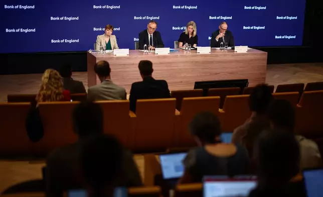 From left: Bank of England (BoE) Deputy Governor Clare Lombardelli, BoE Governor Andrew Bailey, head of media Katie Martin and BoE Deputy Governor for Markets and Banking Dave Ramsden take part in the Monetary Policy Report press conference in London, Thursday, July 30, 2026. (Henry Nicholls/Pool Photo via AP)