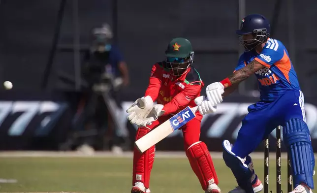 India's captain Shreyas Iyer, right, plays a shot as Zimbabwe's wicketkeeper Tadiwanashe Marumani during the third T20 cricket match between Zimbabwe and India in Harare, Zimbabwe, Sunday, July 26, 2026. (AP Photo/Wonder Mashura)