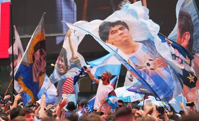Argentina fans gather for a rally on the eve of the World Cup final soccer match in New York's Time Square, Saturday, July 18, 2026. (AP Photo/Julio Cortez)