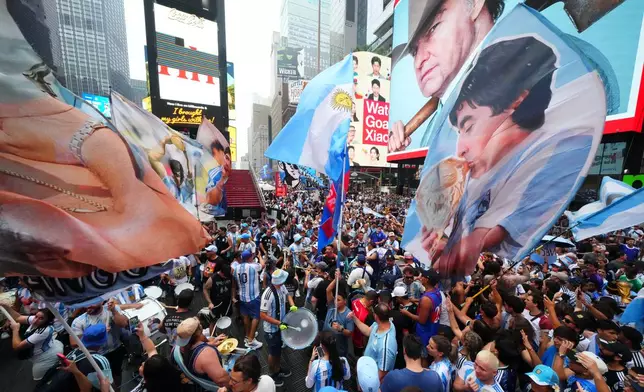 Argentina fans gather for a rally on the eve of the World Cup final soccer match in New York's Time Square, Saturday, July 18, 2026. (AP Photo/Julio Cortez)